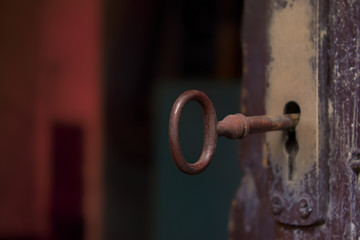 Old Key in Opened Door 