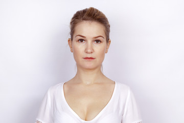 Portrait of a young woman on a white background