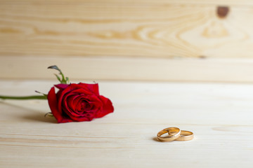 Red rose with wedding ring
