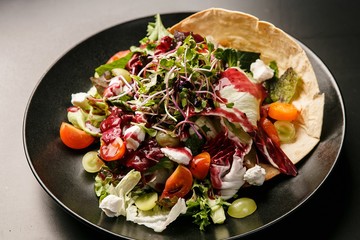 ricotta cheese salad on black dish