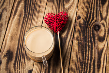 cup of coffee with milk and handmade heart