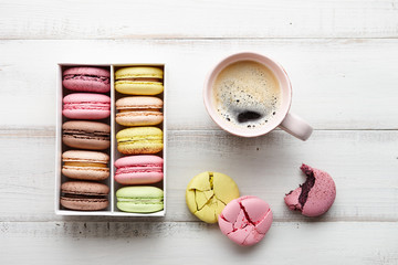 Cup of coffee and macarons