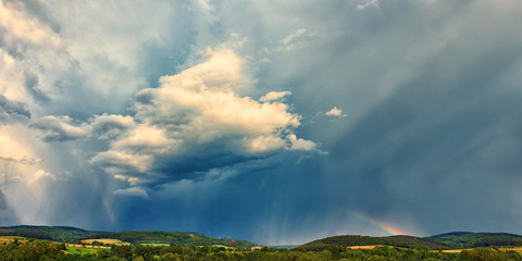 Dramatic Light on Clouds and Rainbow