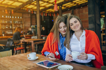 two girls in a cafe