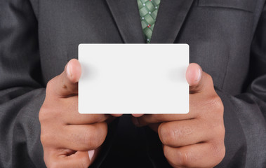 Businessman holding a card
