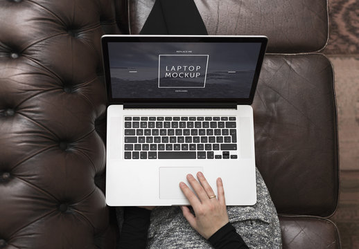 Top View Mockup of Laptop User on Couch Mockup 1