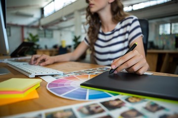 Fototapeta premium Mid section of female graphic designer 