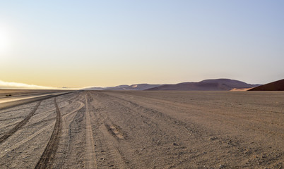 Fototapeta na wymiar dirt road in Namibia at evening time