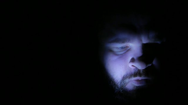 Depressed man in the darkness: depression, sadness, sad, loneliness. 4K UHD