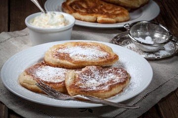 Polish pancakes with powdered sugar.