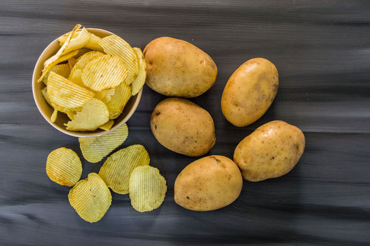 potatoes and potato products, fried potato slices, potato slices fried serrated, fried potato flakes in a furnace,
