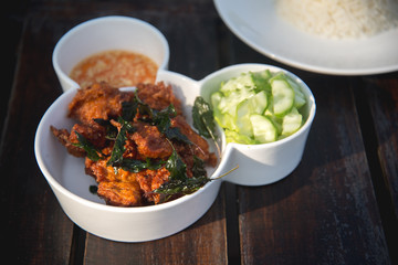 fried fish and cucumber with sauce and rice