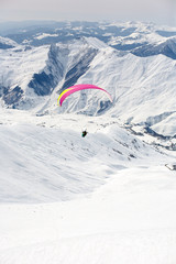 Winter paragliding in Gudauri mountains