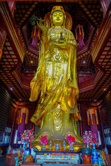 CHONGYUANG TEMPLE, CHINA - 29 JANUARY, 2017: Close up beautiful golden buddha statue, great detailed decorations, part of temple area