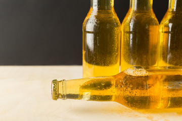 Fototapeta premium Beer bottles on a wooden table .