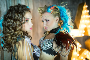 Obraz premium Slavic dance women sexy in the bright suit in stylized studios, sensual girls dancer, sexy makeup.