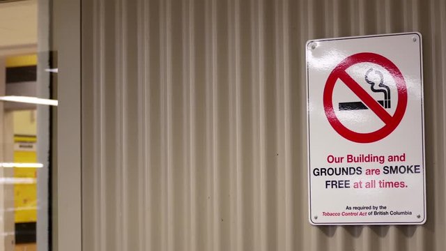 Our building and grounds are smoke free at all times sing on wall