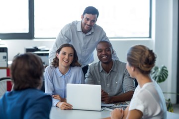 Team of graphic designers interacting with each other