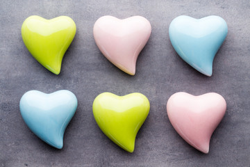Obraz premium Colored heart on the gray background. View from above. Flat lay.