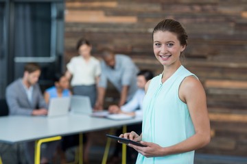 Business executive using digital tablet in office