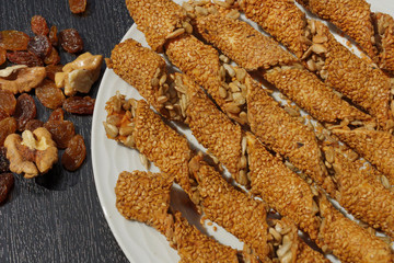 Baked salty cracker with sunflowers seeds, kind of pasta or snack