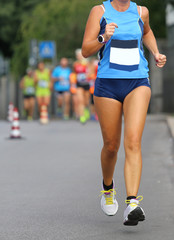 woman athlete running at the marathon