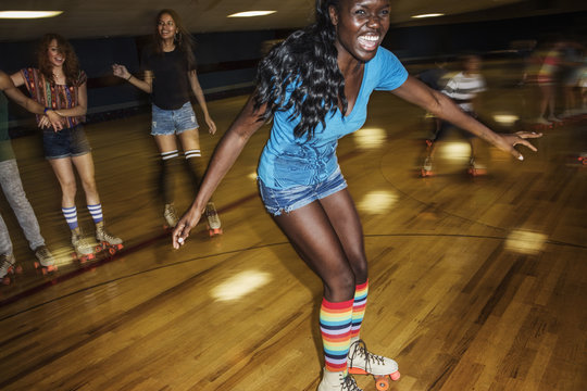 Young People Having Fun On Roller Skating Rink