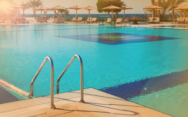 Fototapeta premium Summer swimming pool. Sunny weather. Toning and filter