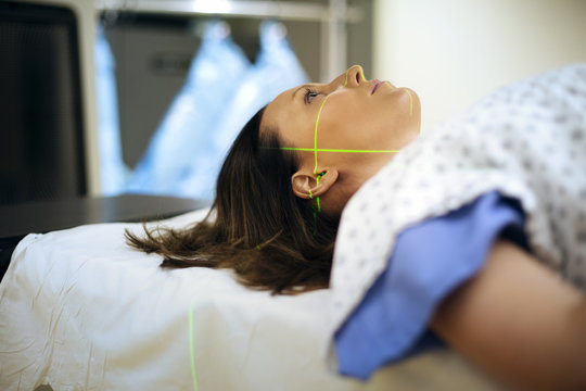 Female patient undergoing  magnetic resonance imaging scanning