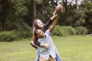 Two friends playing with football