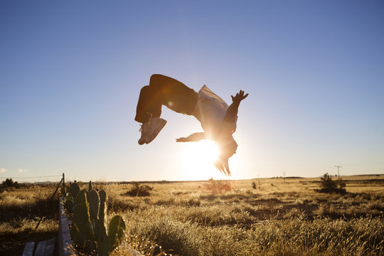 Young man doing somersault