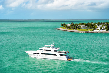Fototapeta na wymiar touristic yachts floating by green island at Key West, Florida