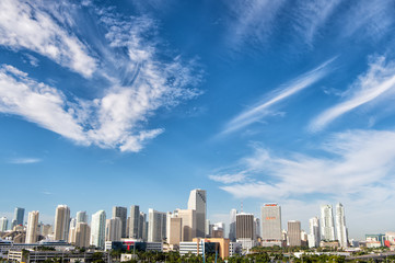 buildings, skyscrapers, hotels and urban houses on cloudy blue sky