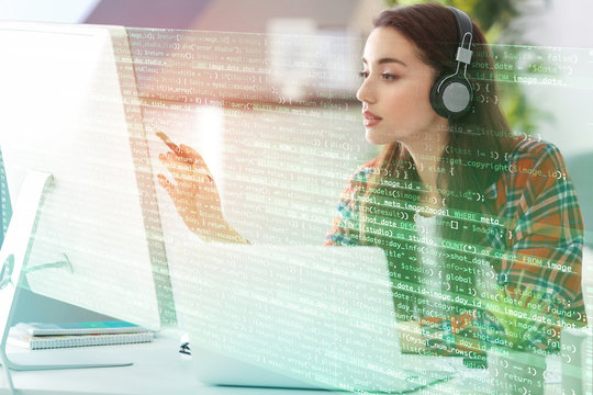 Young Woman Programmer Working At Office