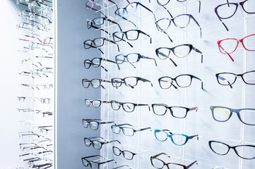 Showcase with glasses in modern optic store