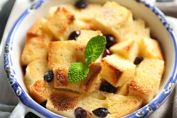 Bowl with delicious bread pudding, closeup
