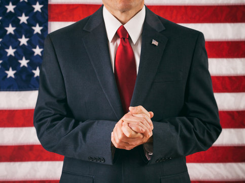 Politician: Man With Hands Clasped And Praying