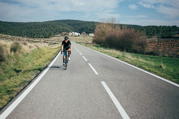 Fototapeta premium Male professional cyclist climbing in the Spanish mountains