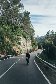 Male professional cyclist climbing in the Spanish mountains