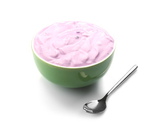 Bowl of delicious yogurt on white background