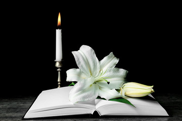 Holy Bible and Easter white lily on table
