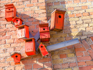 Birdhouses on a brick wall, Riga,  Latvia