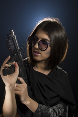 Young girl with  shawl and sunglasses posing as bad girl 