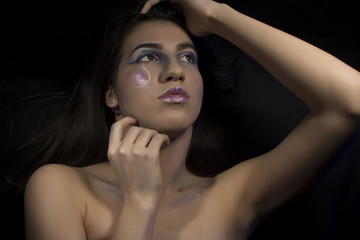 Portrait of a young girl with artistic make up