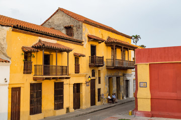 CARTAGENA, COLOMBIA - MAY 24: Unidentified people stand in front of the colonial Casa Peter in the late afternoon in Cartagena, Colombia on May 24, 2016.