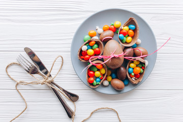 Easter concept. chocolate eggs and sweets on a white background