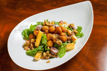 Potato croquettes with peanut capita and anchovy fillets