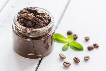 Organic scrub from ground coffee on table background