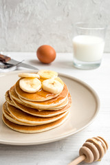 cooked pancake on plate at wooden background