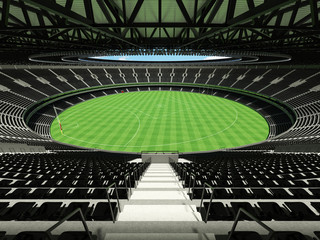 Naklejka premium 3D render of a round Australian rules football stadium with black seats and VIP boxes